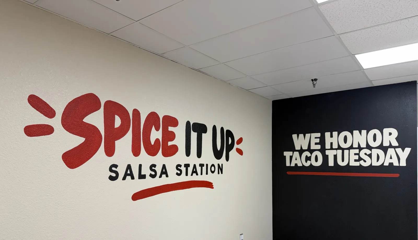 Spice It Up Salsa Station mural inside La Flama Taqueria
